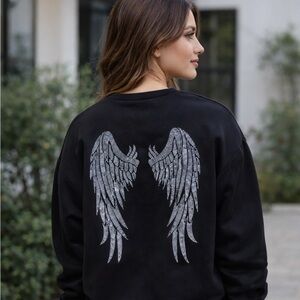 Black sweatshirt with sequins angel wings
